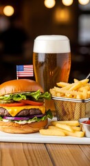 A classic hamburger with fries and a tall glass of beer is ready to eat.