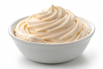 Delicious white whipped cream swirl in a bowl isolated on white background. Sweet vanilla mousse, yogurt or frosting texture for dessert topping and bakery concepts.