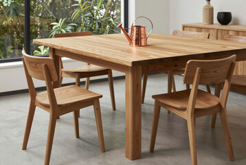 Wooden dining table and chairs in a room.