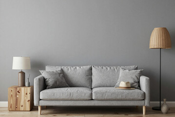 Living room with a gray couch and a lamp.