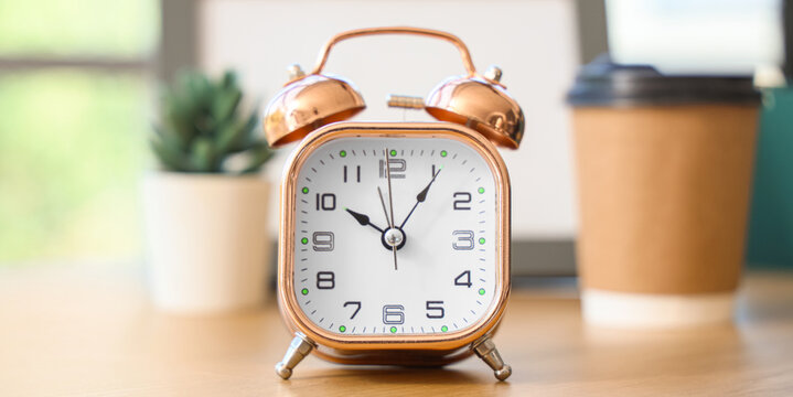 Alarm clock on desk in office, closeup