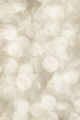 Silver Sparkling Lights Festive background with texture. Abstract Christmas twinkled bright bokeh defocused and Falling stars.