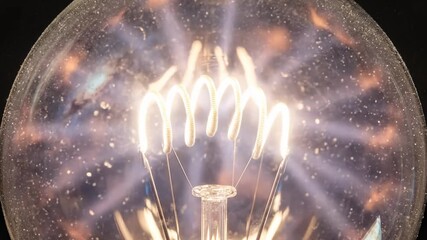 Light Bulb Filament Ignites and Shines Brilliantly Close Up