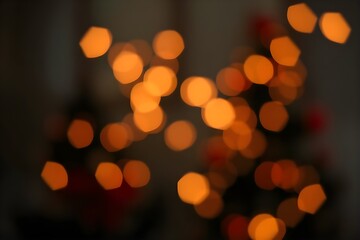 Golden bokeh lights in soft focus create a dreamy festive background, perfect for holiday designs, invitations, and cozy seasonal moods.