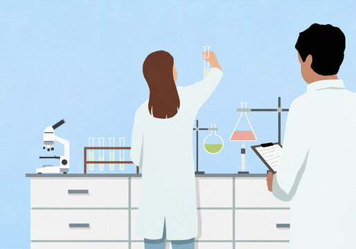 Scientists conducting experiment in chemistry laboratory
