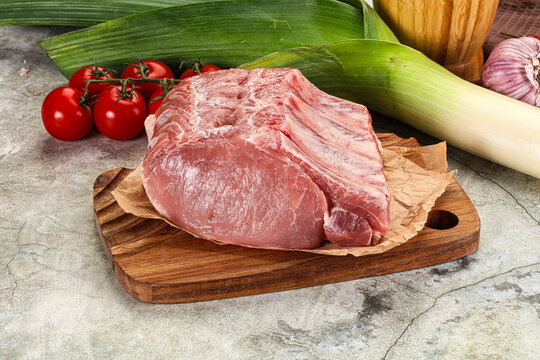 Raw pork loin cut with bone - Powered by Adobe