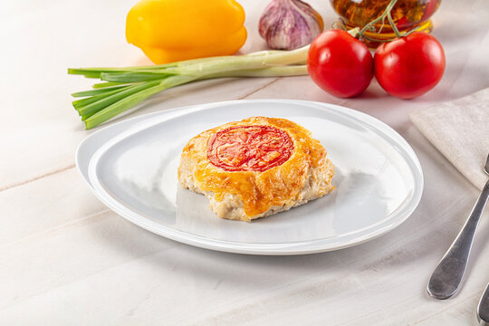 Chicken chop cutlet with cheese and tomato