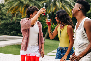 Beer pong with friends outdoors