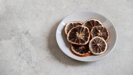 Dehydrated Dry Lemon Slices in a white plate	