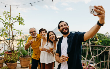 Family taking a selfie together during a rooftop gathering