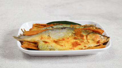 Delicious presto milkfish in a white plate. bandeng presto	