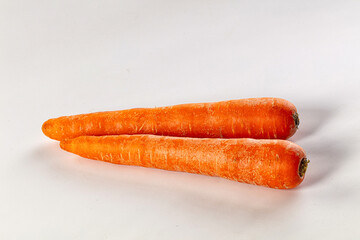 Young orange ripe carrot heap
