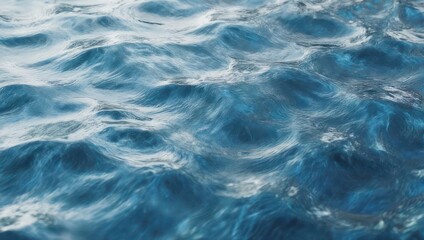 Fototapeta premium Gentle blue ocean waves rippling under the bright sunlight.