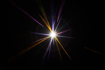 Lens Flare. Light over black background. Easy to add overlay or screen filter over photos. Abstract sun burst with digital lens flare background. Gleams rounded and hexagonal shapes, rainbow halo.