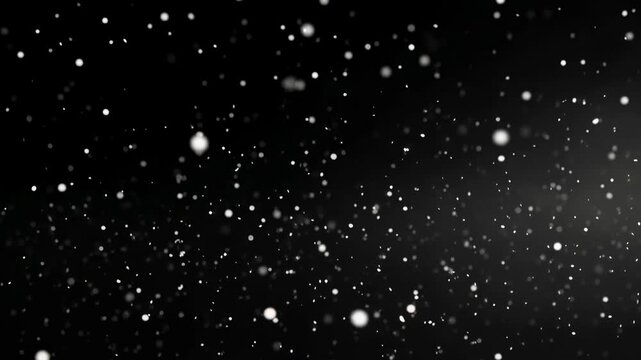 Dense snowfall sparkles against black space creating a dreamy glittering blizzard that suggests cold weather celebration festive atmosphere and cinematic winter scenes for overlays transitions and hol