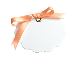 White tag w/ peach bow on black background, angled view