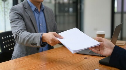 Corporate hands exchanging essential documents during a business meeting transaction process on desk