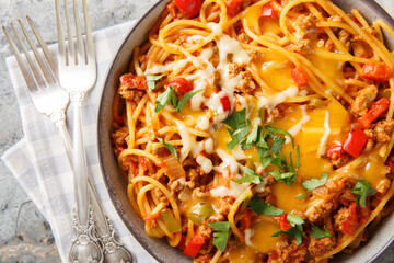Taco Pasta is creamy, spicy and an easy Italian meets Mexican dinner closeup on the plate on the table. Horizontal top view from above
