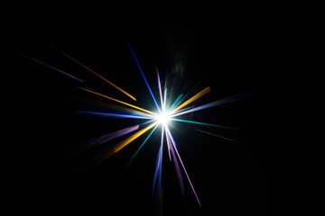Fototapeta premium Lens Flare. Light over black background. Easy to add overlay or screen filter over photos. Abstract sun burst with digital lens flare background. Gleams rounded and hexagonal shapes.