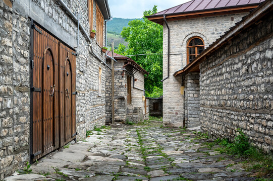 Stone houses line a quiet street in the mountain village of Lahij, Azerbaijan.