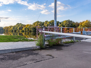 Metal pole with a red and white sign on it