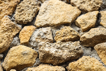 Texture of old stone wall as background, closeup