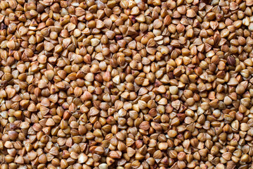 The texture of raw buckwheat. Natural healthy buckwheat