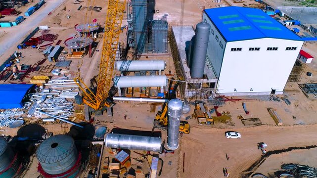 Large Industrial Shipyard Construction Site Aerial View with Cranes