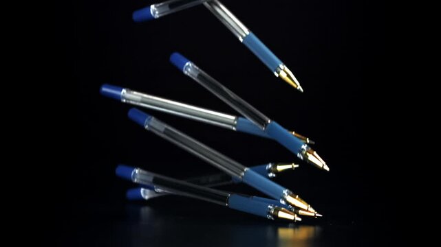 The pens fall on the table. Filmed on a high-speed camera at 1000 fps. High quality FullHD footage