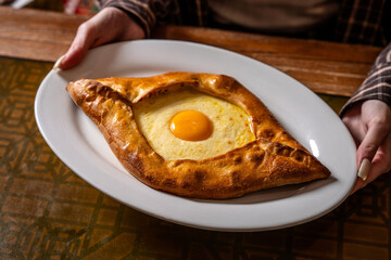 Georgian cheese boat with egg yolk