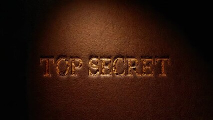 Sweeping warm spotlight intensifying over brown leather cover, revealing TOP SECRET embossing - Powered by Adobe