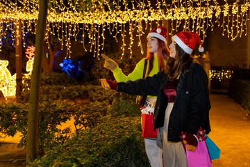 Gen z women friends christmas shopping in valencia