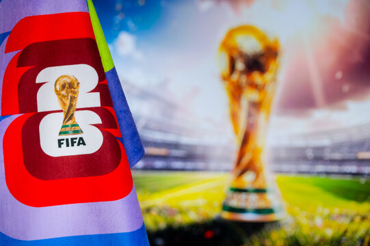 FIFA World Cup in 2026 background, official logo of World cup in United States, Mexico and Canada and colorful blurred background with gold trophy.