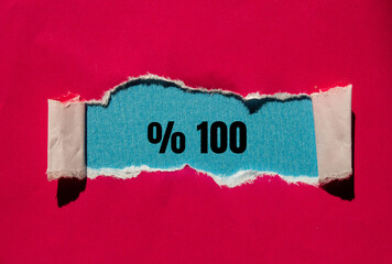One hundred percent message written on ripped torn paper background. Conceptual One hundred percent symbol. Copy space.