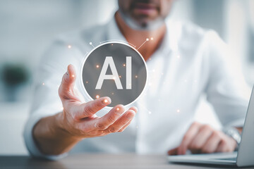 Businessman holding glowing AI hologram symbolizing innovation and technology.