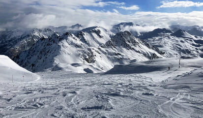 Beautiful view on snowy mountain range and ski slope in Austria Alps, Obertauern at winter
