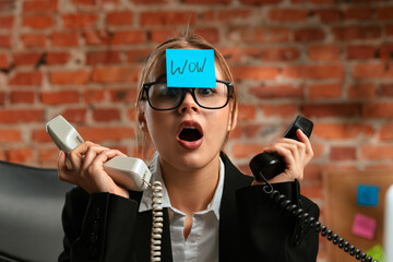 Surprised Businesswoman With Sticky Note on Forehead