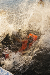 Wave Crashing Over Person In Survival Suit, Explosive Spray And Ice Fragments, Blurred Silhouette Swallowed