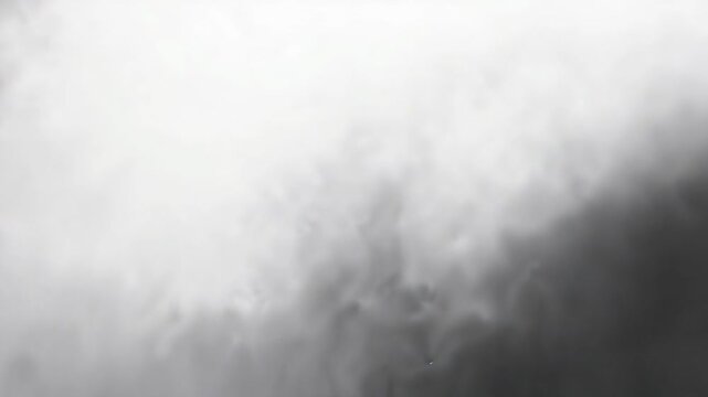 Darker mass appearing sparking dense smoke plume growing in open sky, with density rising