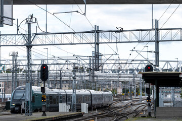 Urban mobility and commute across railway infrastructure and junctions with overhead lines and tracks in the expanding rail network of Oslo Station