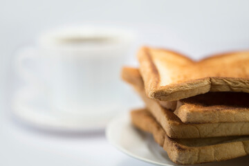 Breakfast with coffee and toast on white background