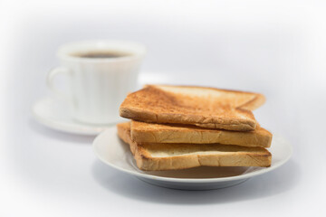 Breakfast with coffee and toast on white background