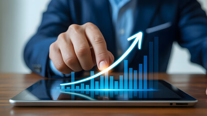 Hand Interacting With Rising Growth Chart on Tablet in Modern Office