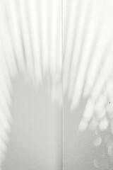 Soft palm leaf shadows cast on a light neutral background. Color of the Year 2026, Cloud Dancer