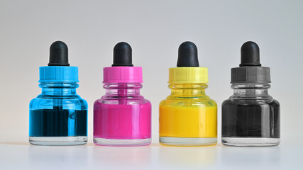 CMYK watercolor paint pots.