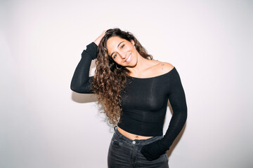 Fototapeta premium Happy young adult woman posing with confidence