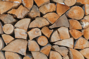 Fototapeta premium Stack of Chopped Firewood Ready for Winter Heating