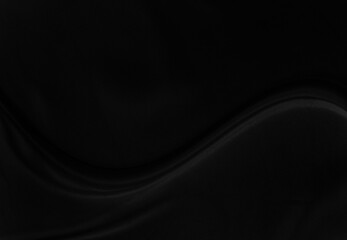Black gray satin dark fabric texture luxurious shiny that is abstract silk cloth background with patterns soft waves blur beautiful.
