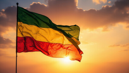 Ethiopian flag waving in the wind against a beautiful sunset backdrop