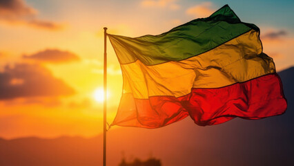 Ethiopian flag waving in the wind against a vibrant sunset sky